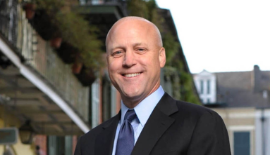 mitch landrieu standing in front of housing